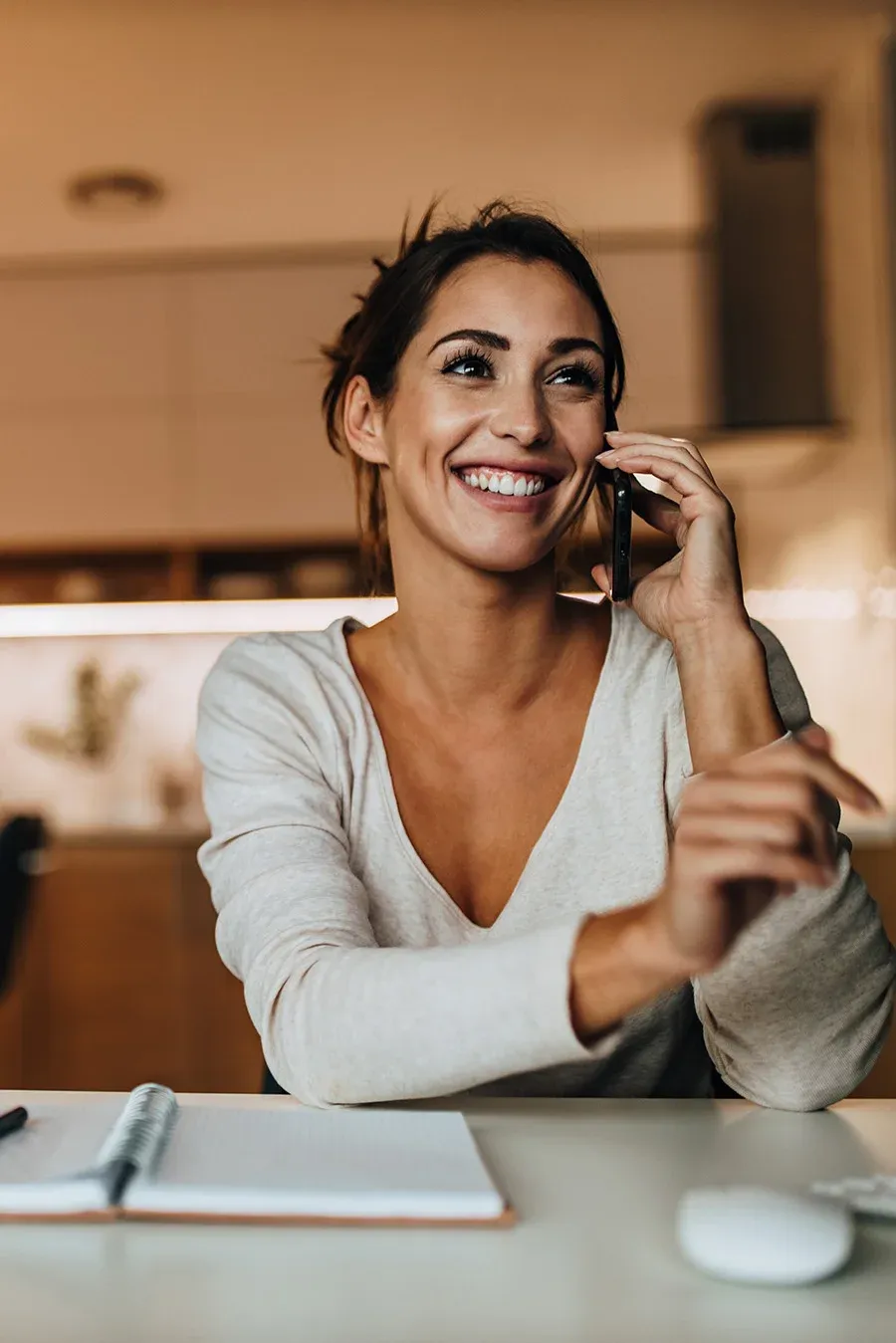 A calm phone conversation at a desk.