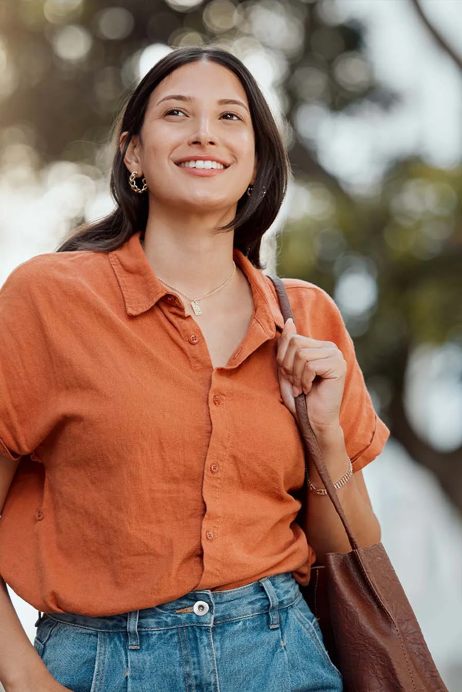 Person smiling and thinking about addiction therapies