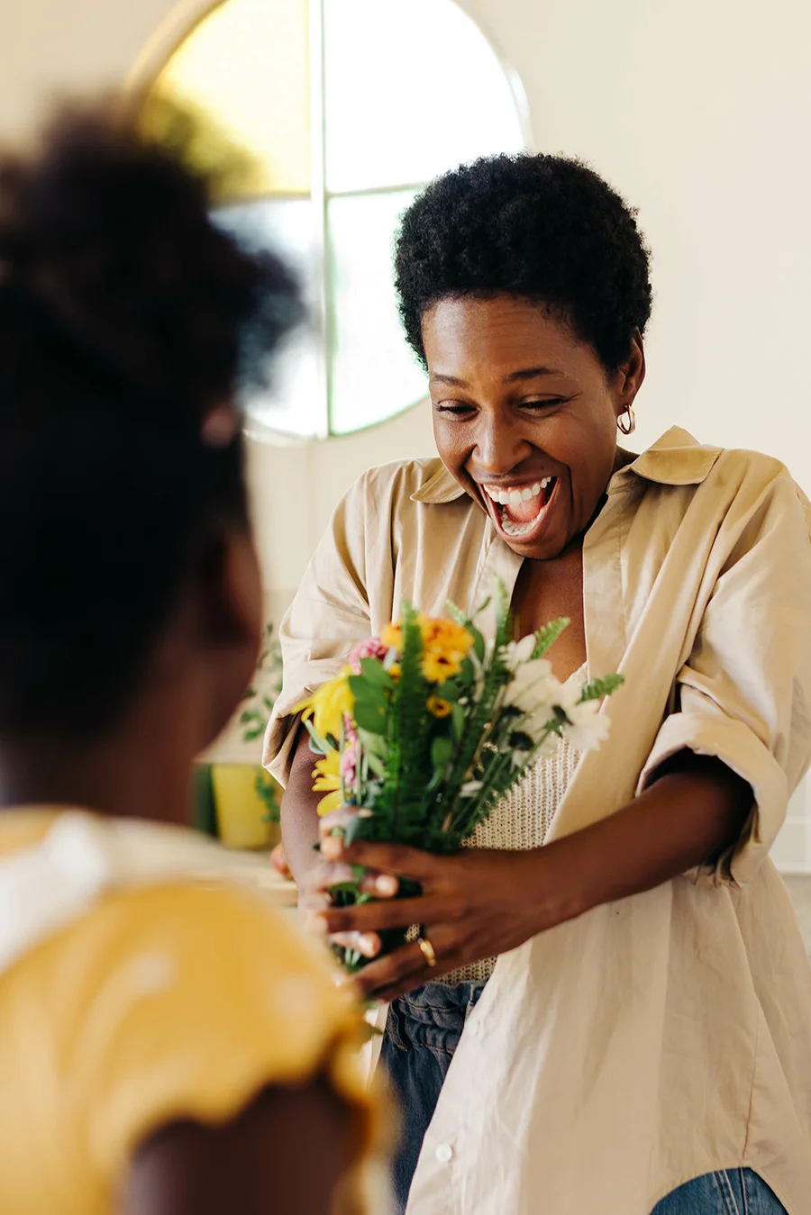 Person appreciating flowers while thinking of medication-assisted treatment