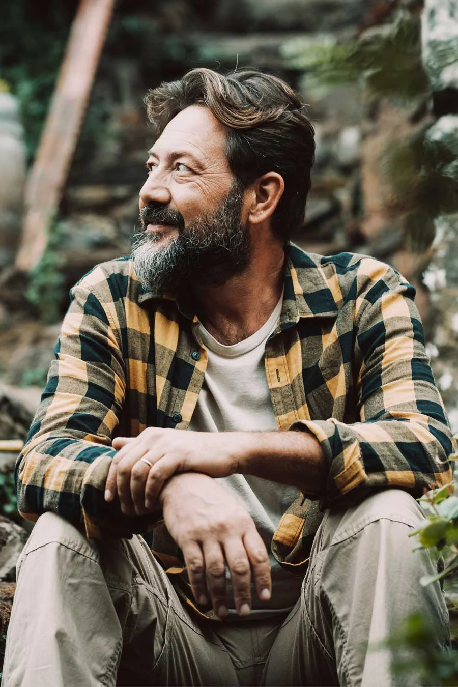 Person sitting outside and thinking about aftercare support