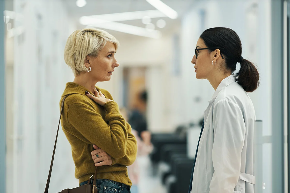Woman talking to doctor at Suboxone clinic
